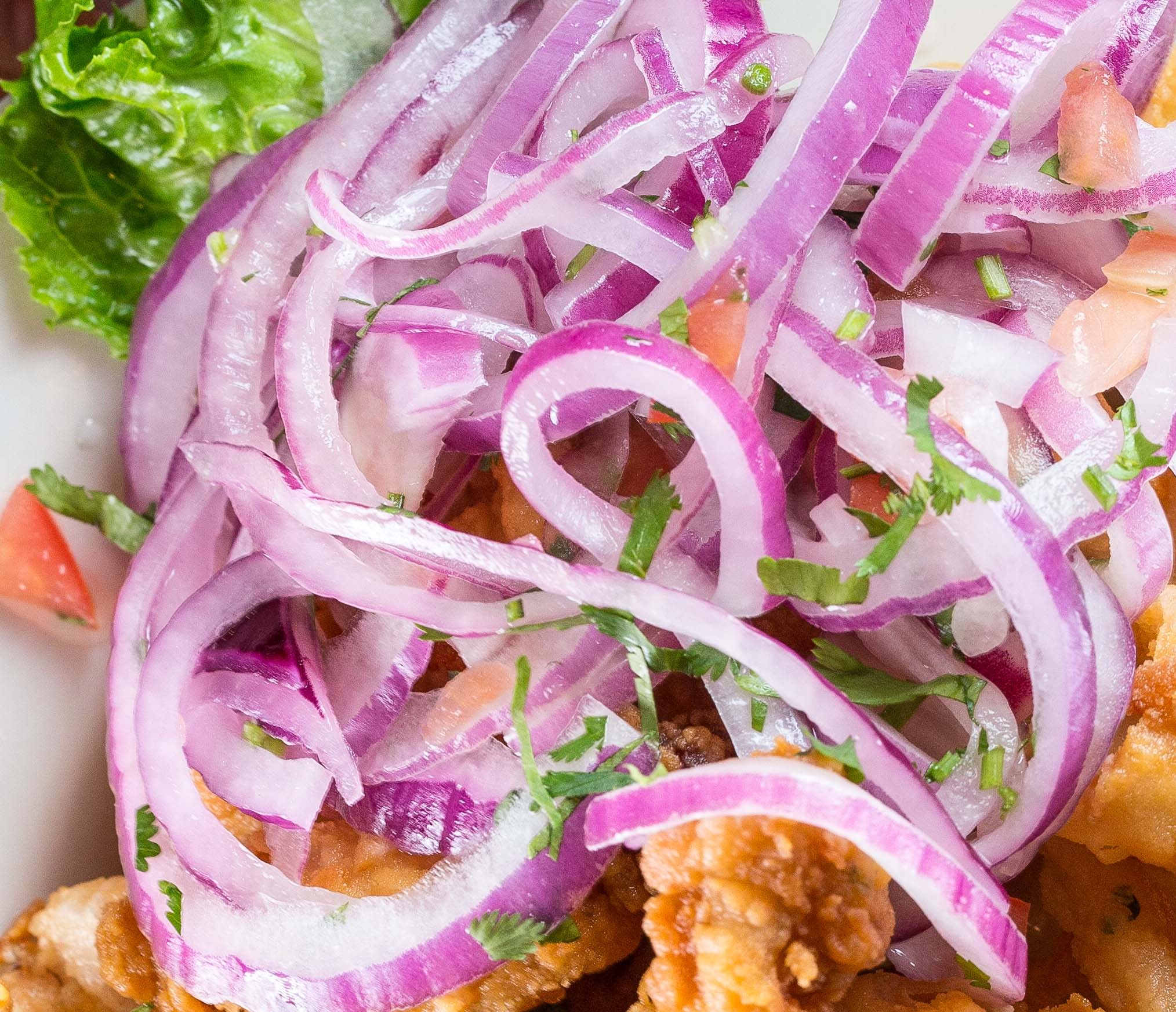 Order Salsa Criolla food online from Riko Peruvian Cuisine store, Queens on bringmethat.com