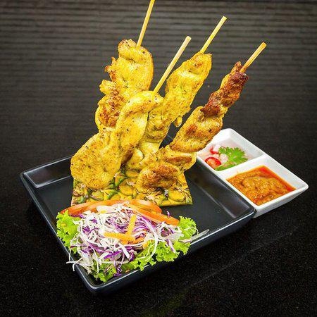 Order 4. Four Piece Chicken Satay food online from 3 Seasons Thai Bistro store, Oakland on bringmethat.com