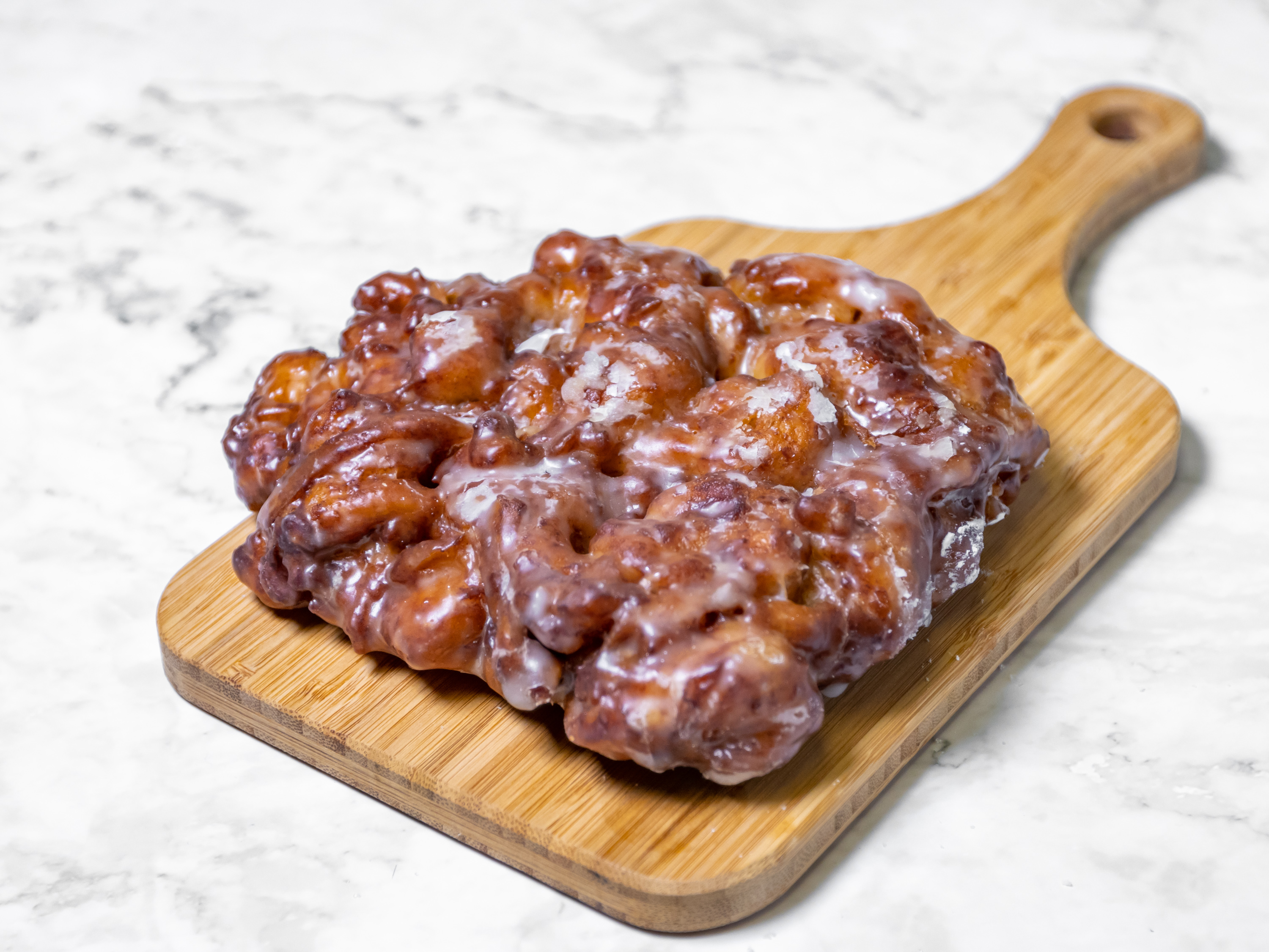 Order Apple Fritter Donut food online from Master Donuts store, Fontana on bringmethat.com