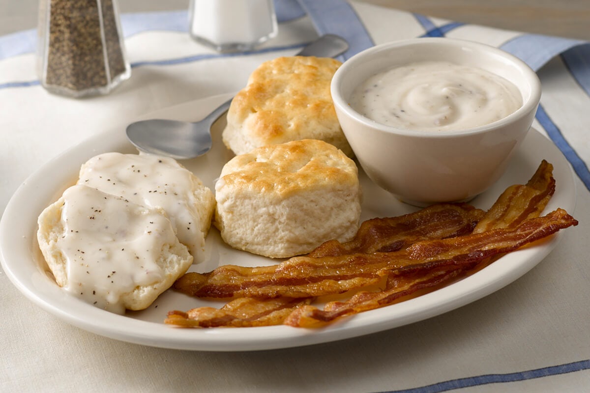 Order Biscuits n' Gravy with Bacon or Sausage food online from Cracker Barrel store, Rochester on bringmethat.com
