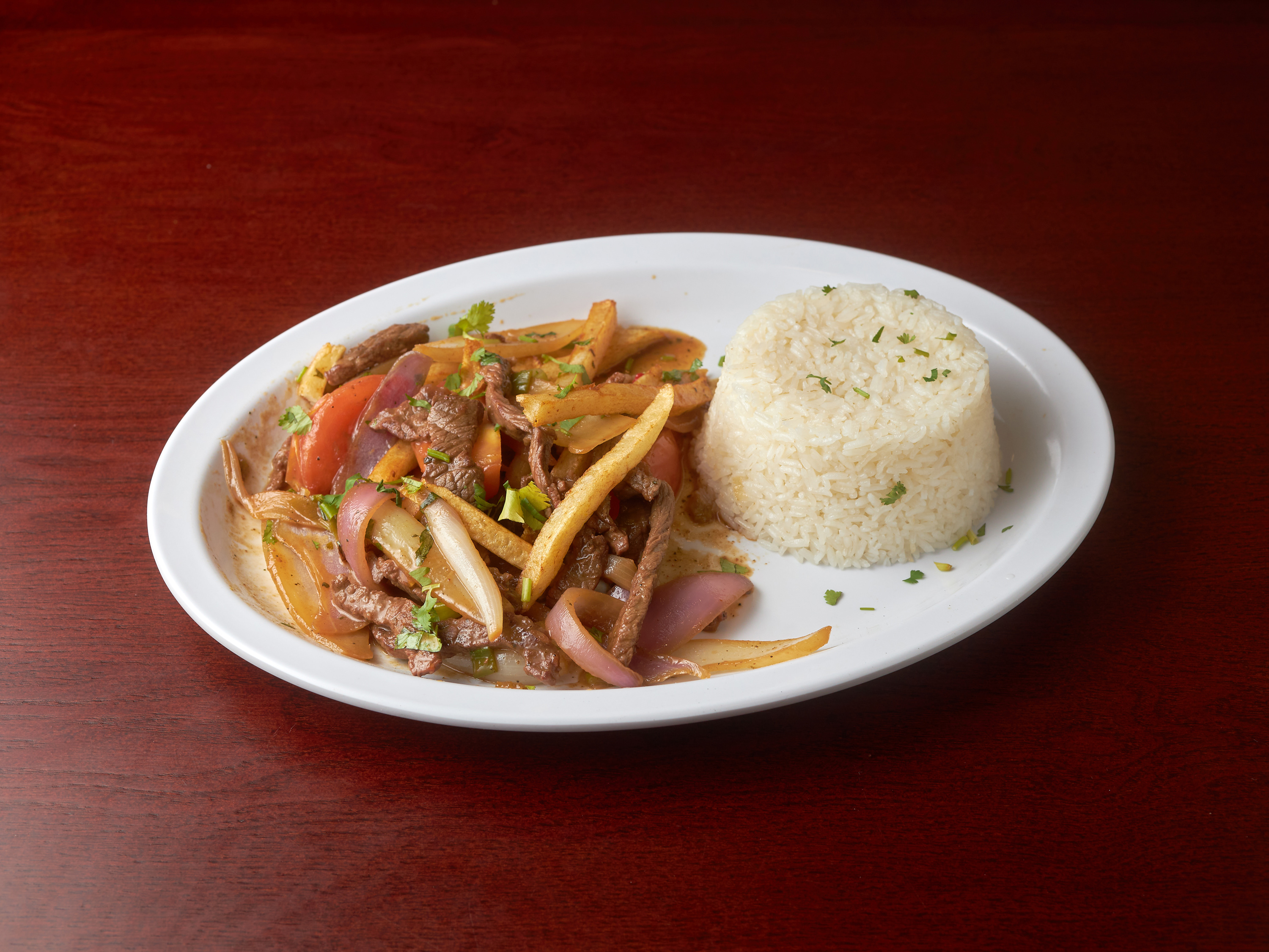 Order Lomo Saltado food online from Don Miguel Restaurant store, Jamaica on bringmethat.com