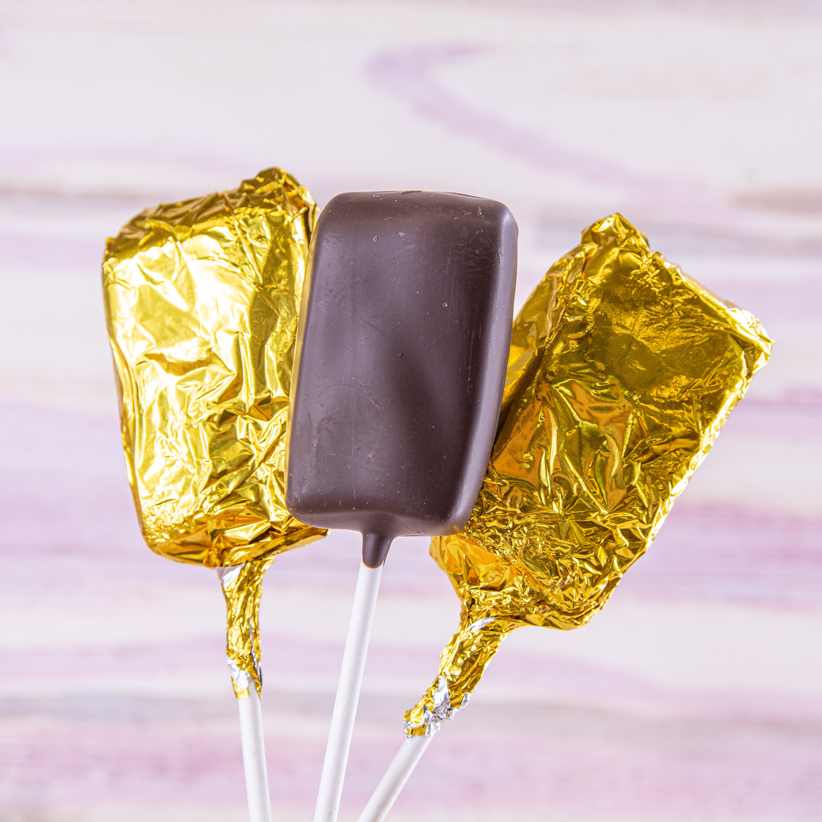 Order Molasses Taffy Pops, Dark Chocolate food online from Wockenfuss Candies store, Columbia on bringmethat.com