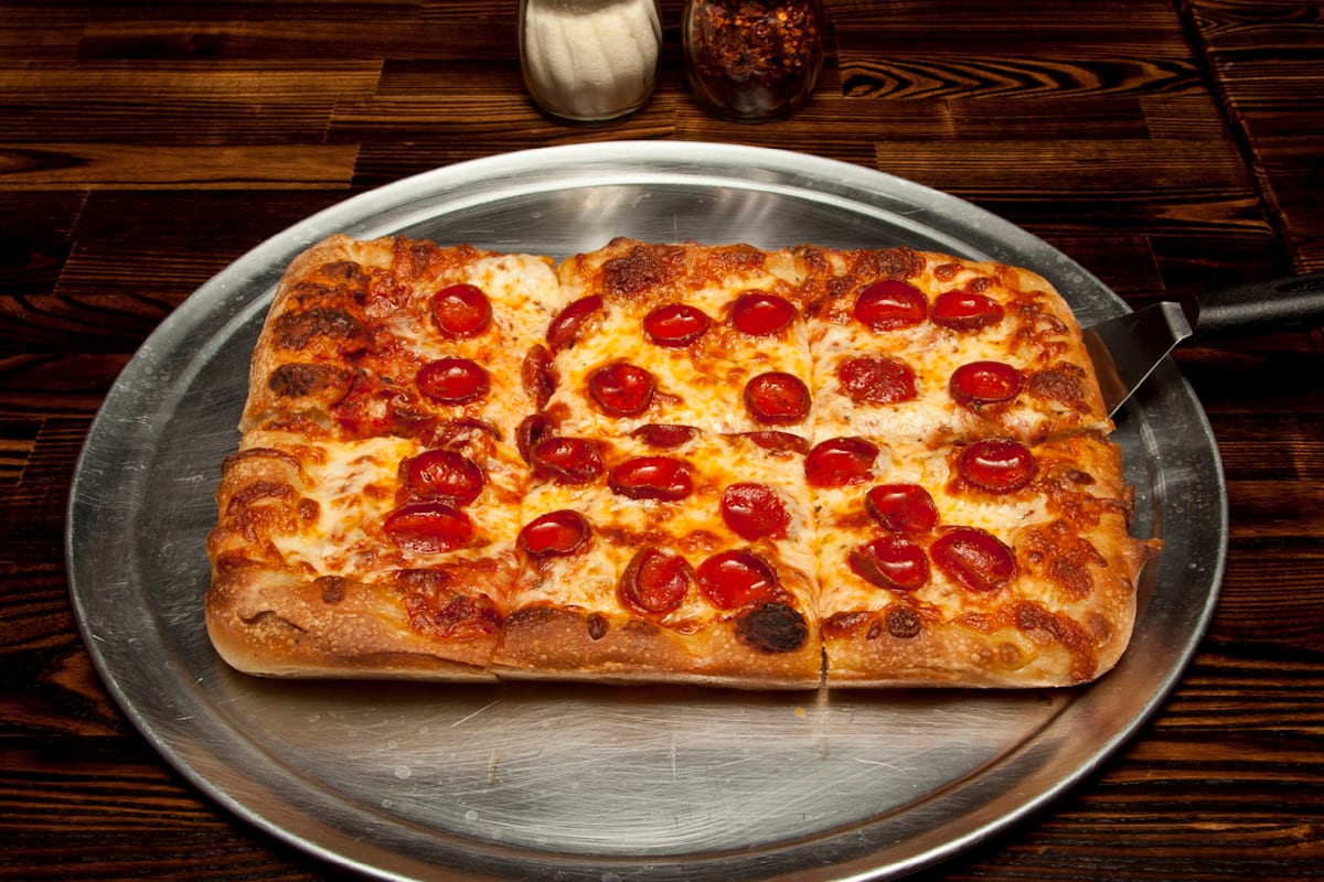 Naked City Pizza Express Delivery Menu | Order Online | 4930 West