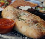 Order Meat Lovers Calzone food online from Mancini's New York Deli & Pizzeria store, Fayetteville on bringmethat.com