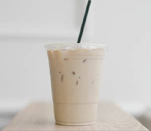 Premium Photo  Smoothie plastic cup milkshake on grey background