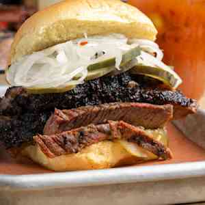 Brisket sandwich with onions and pickles
