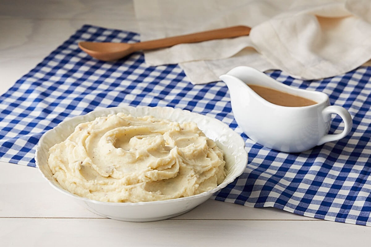Order Mashed Potatoes w/Brown Gravy food online from Cracker Barrel store, Rochester on bringmethat.com