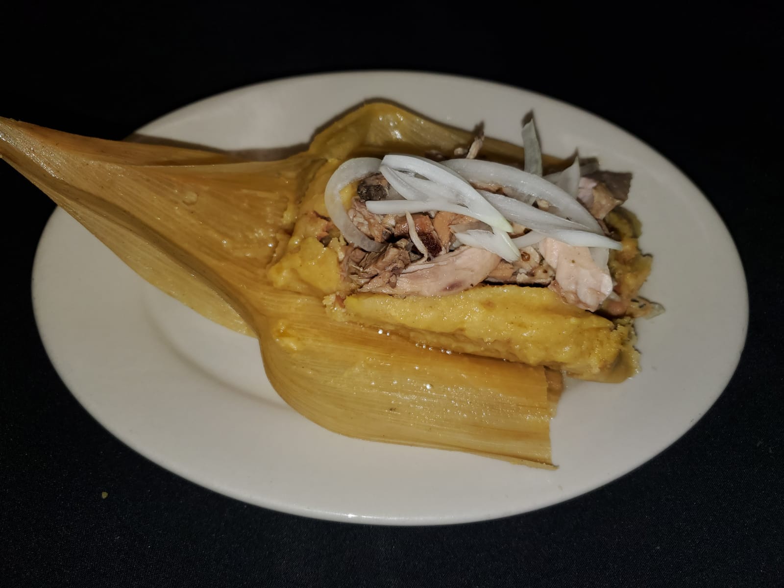 Order Tamal con Puerco food online from La Teresita Restaurant store, Pinellas Park on bringmethat.com