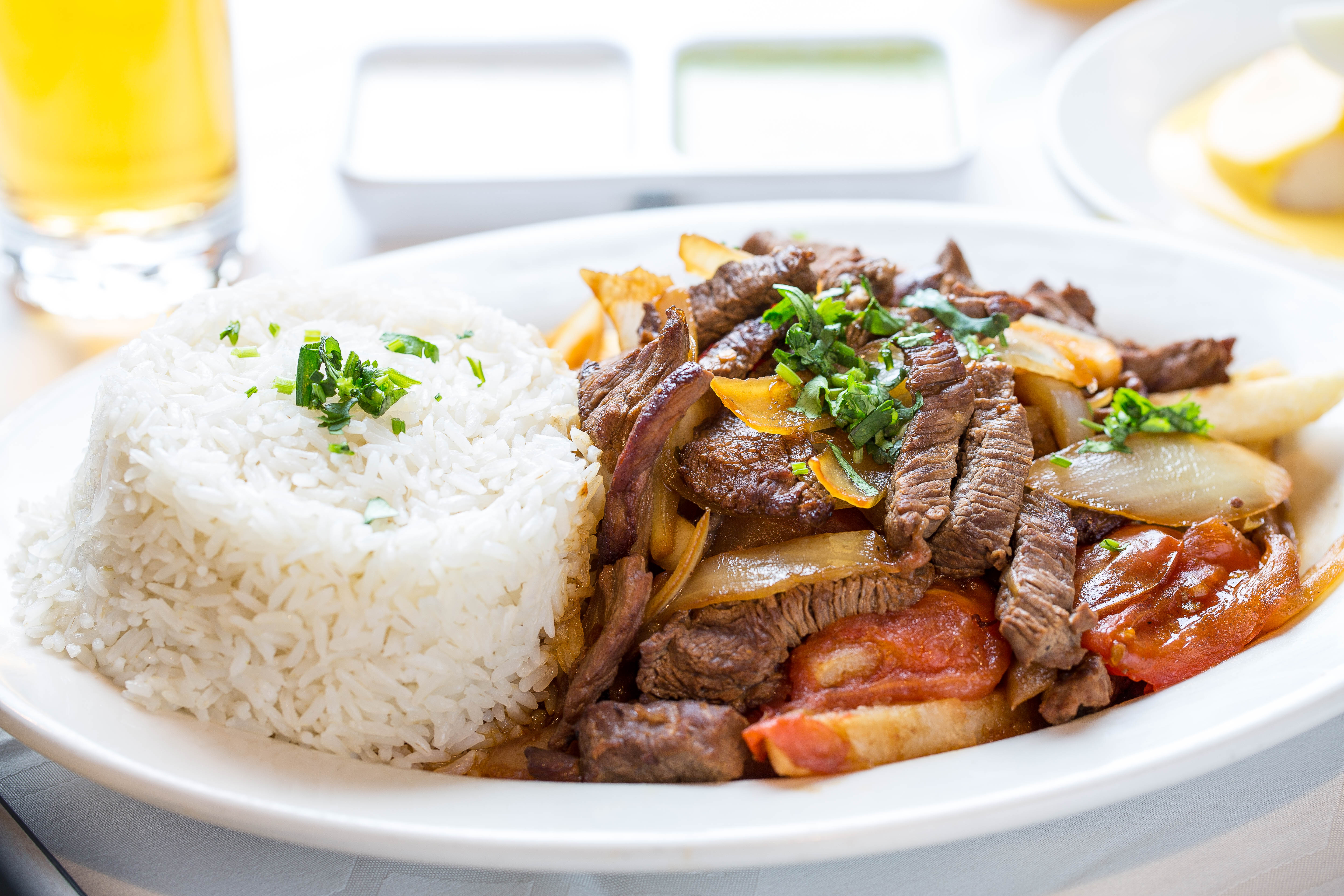 Order Lomo Saltado food online from Riko Peruvian Cuisine store, Queens on bringmethat.com