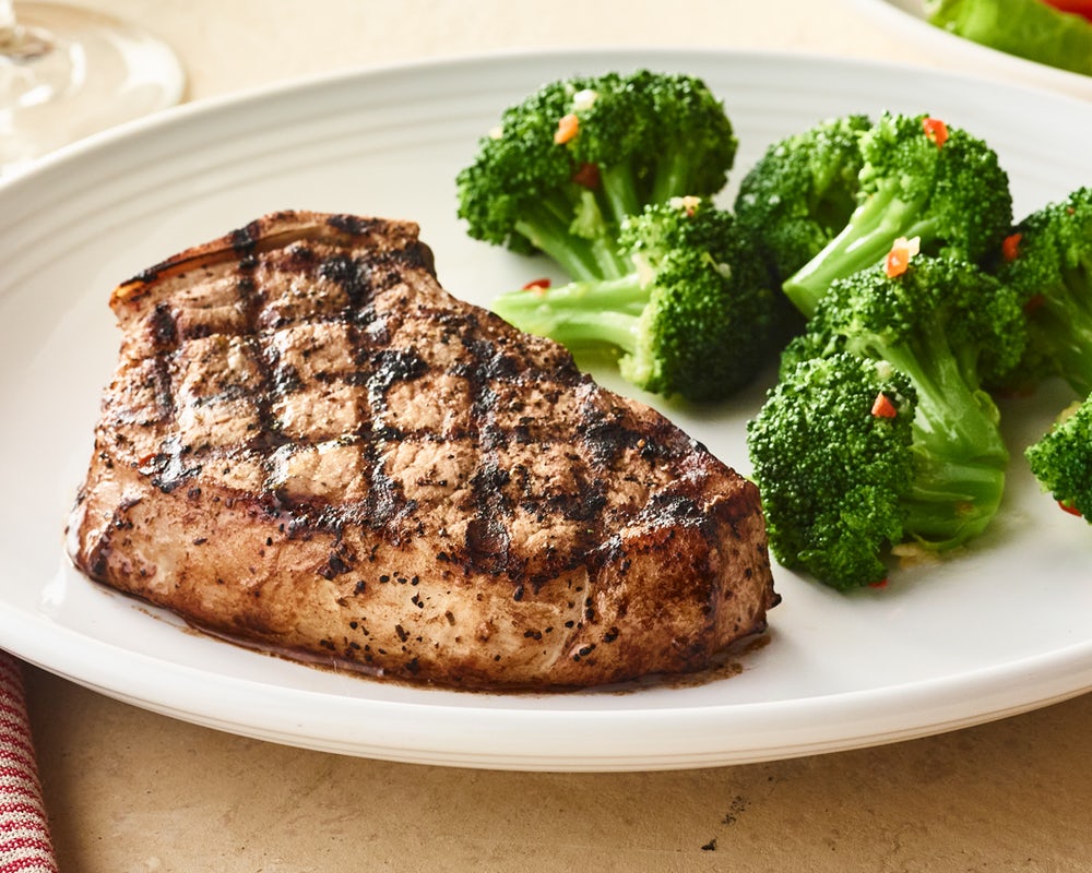 Order Tuscan-Grilled Pork Chop* - One Chop	 food online from Carrabba's Italian Grill store, Murrells Inlet on bringmethat.com