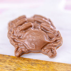 Order Milk Chocolate Crabs, 4 pc. Bag food online from Wockenfuss Candies store, Columbia on bringmethat.com
