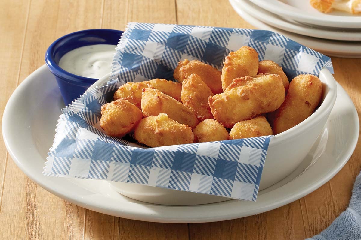 Order White Cheddar Cheese Bites food online from Cracker Barrel store, Rochester on bringmethat.com