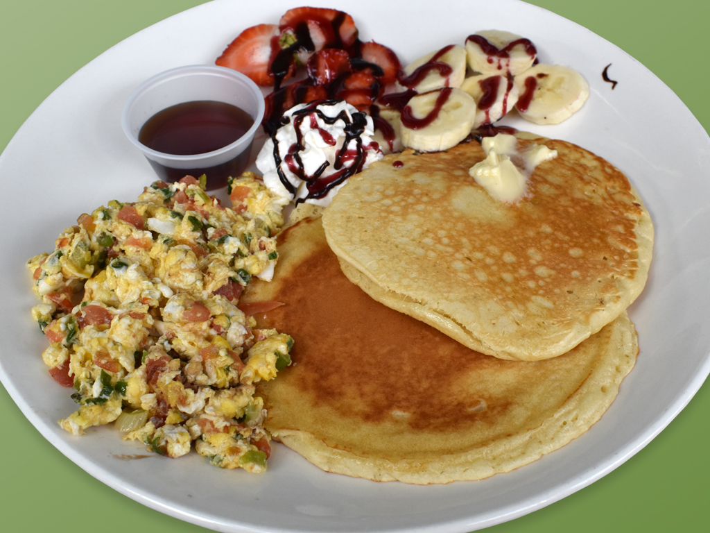 Order Pancakes con huevos perico y fruta food online from Cositas Ricas Corp store, Queens on bringmethat.com