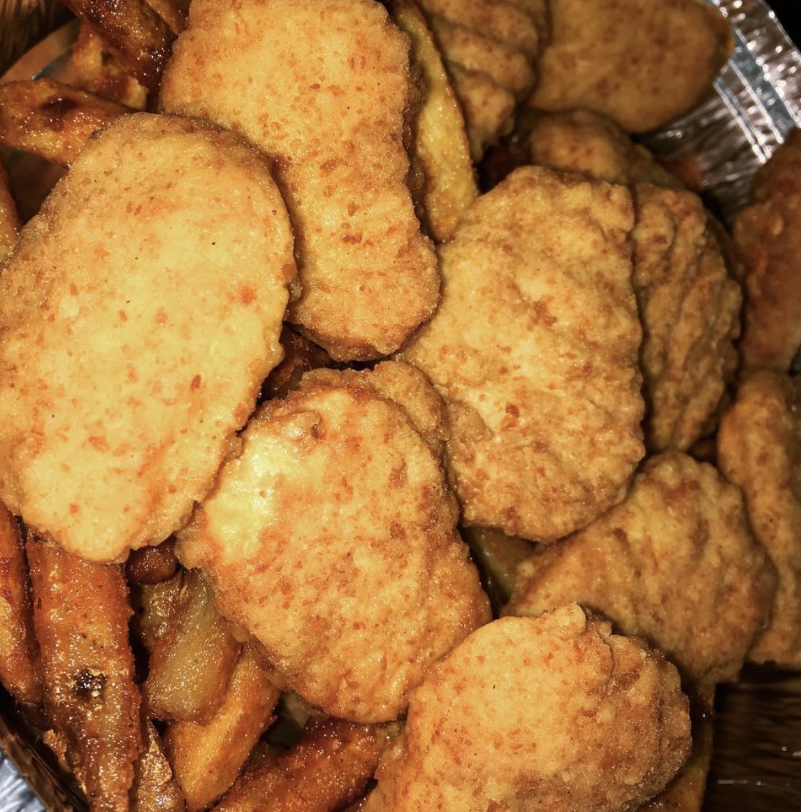 Order 12 Pieces Nuggets with Fries food online from Halal Munchies store, Queens on bringmethat.com