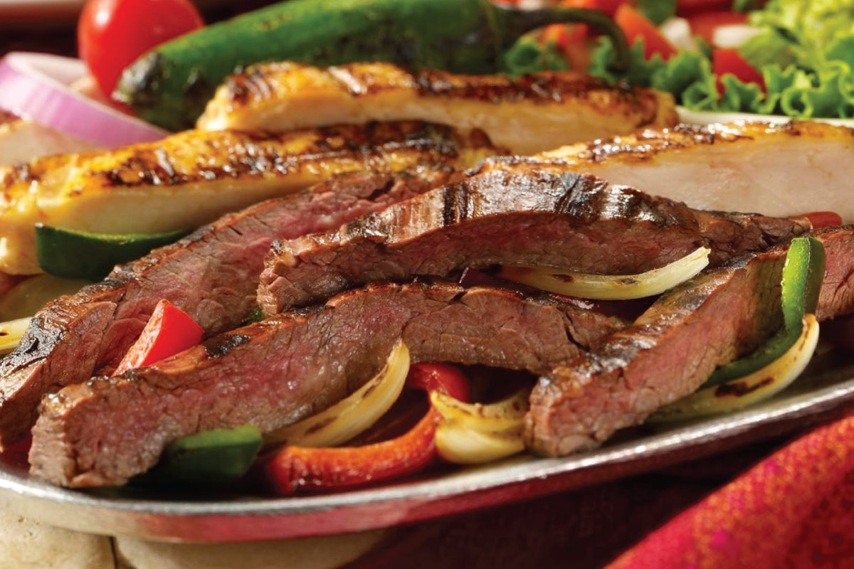 Order Steak and/or Chicken Fajitas for Two food online from Uncle Julio's store, Brentwood on bringmethat.com