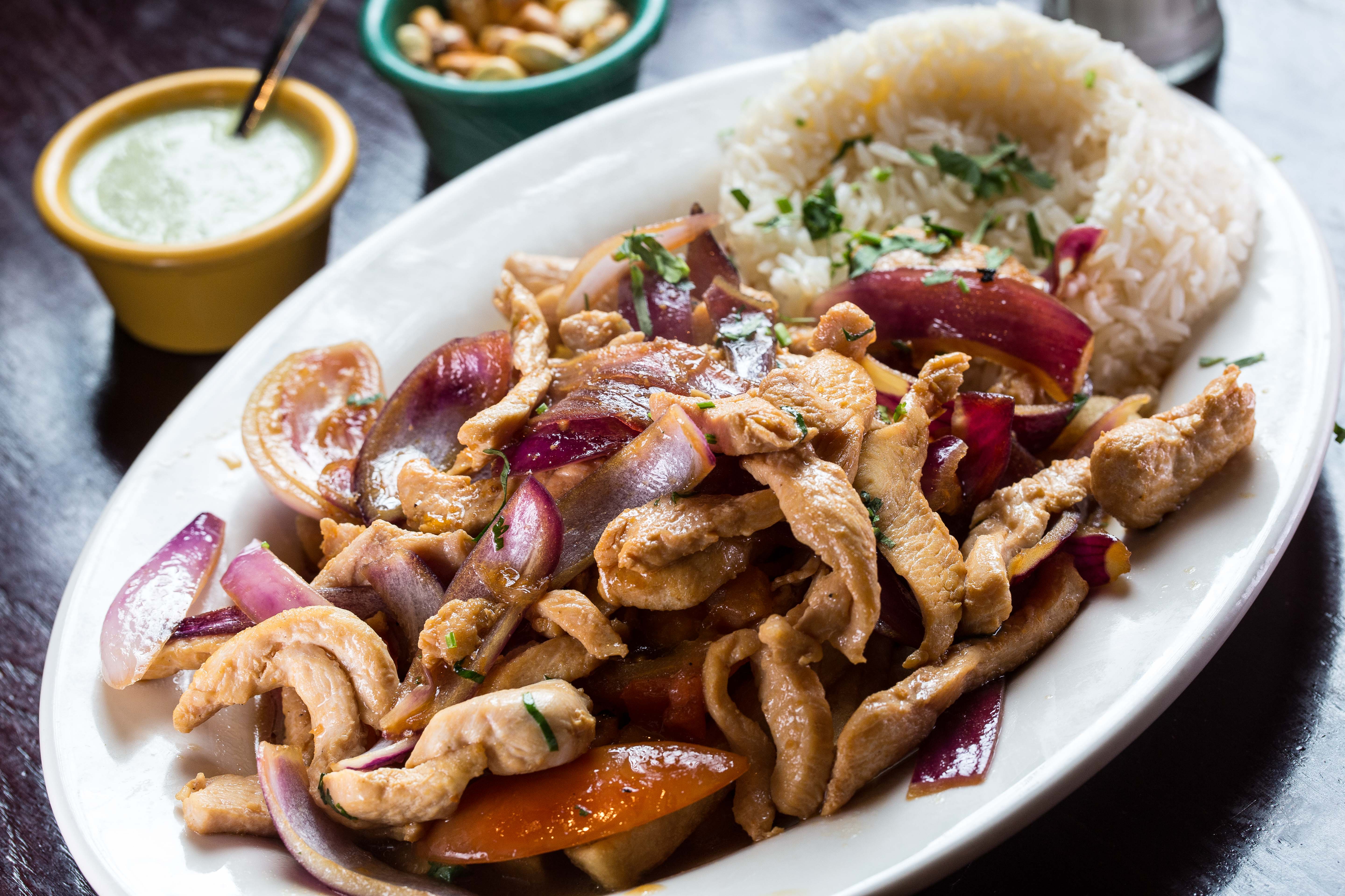Order Pollo Saltado food online from Riko Peruvian Cuisine store, Queens on bringmethat.com