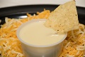 Order Side of Chips and Queso food online from Burracho's store, Eau Claire on bringmethat.com