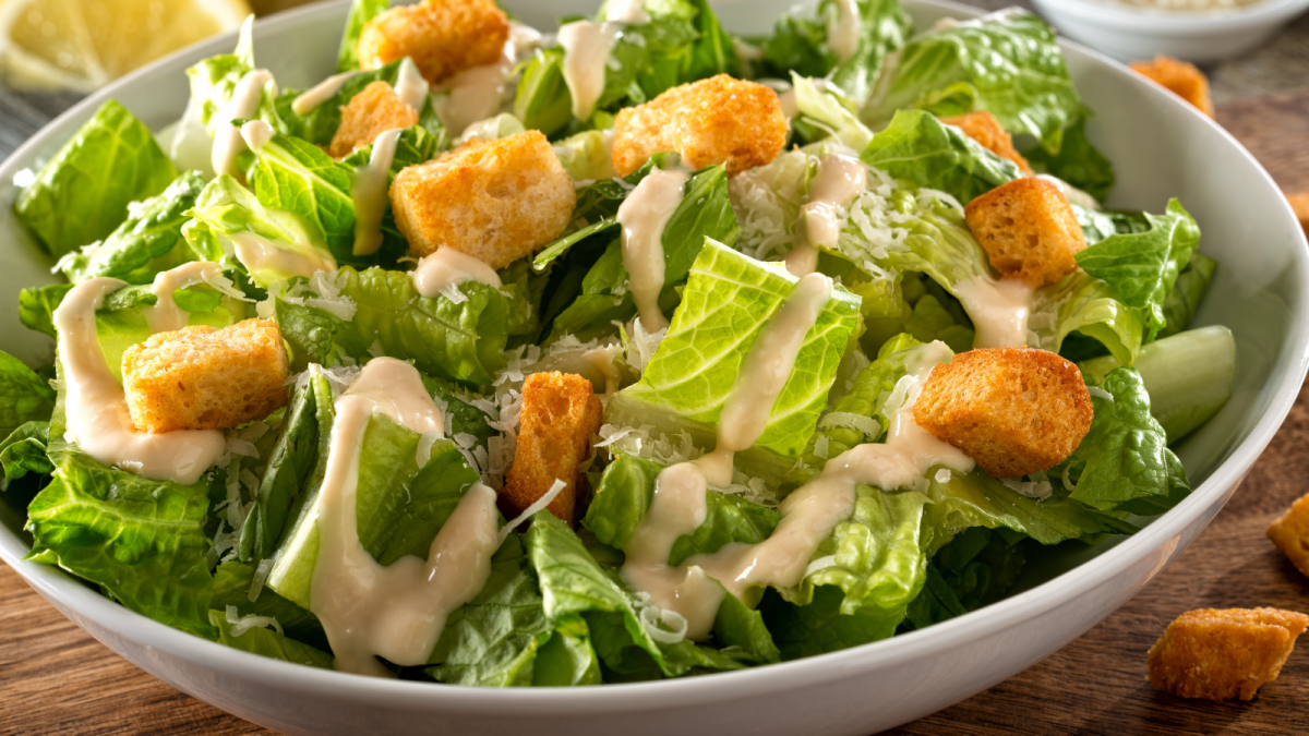 Order Caesar Salad (VG) food online from Afro Deli store, Saint Paul on bringmethat.com