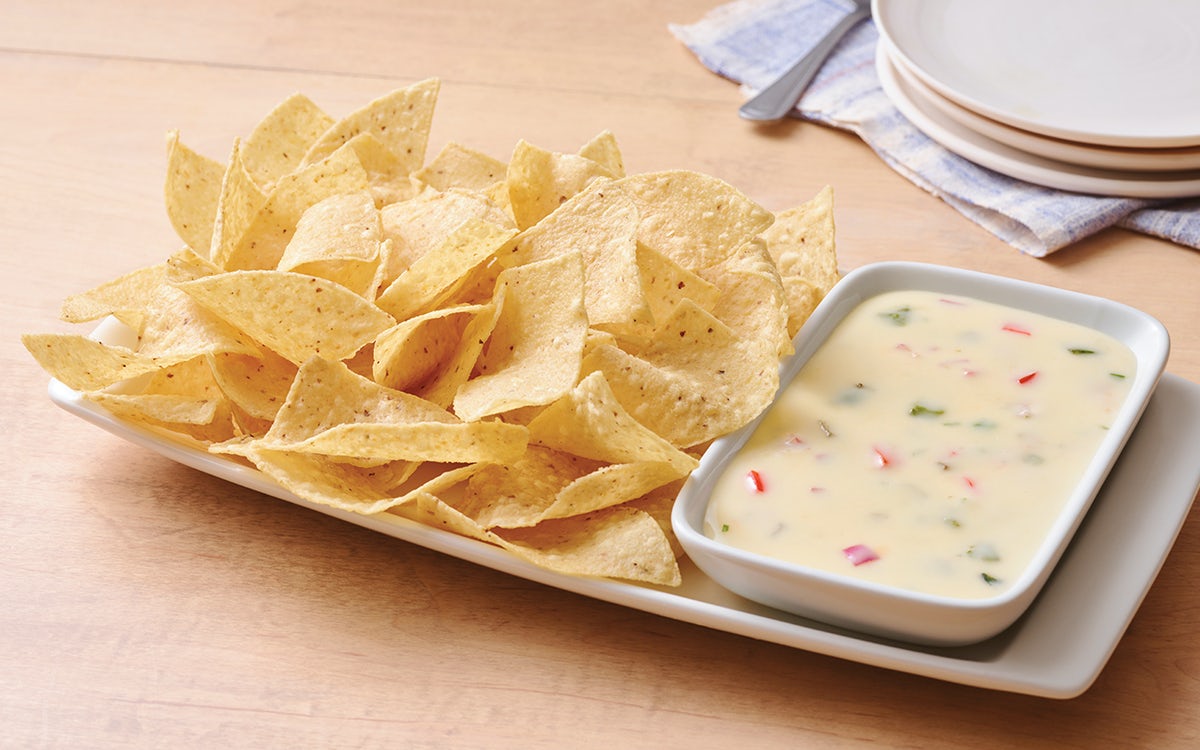 Order White Queso Dip & Chips food online from Applebee's store, Royersford on bringmethat.com