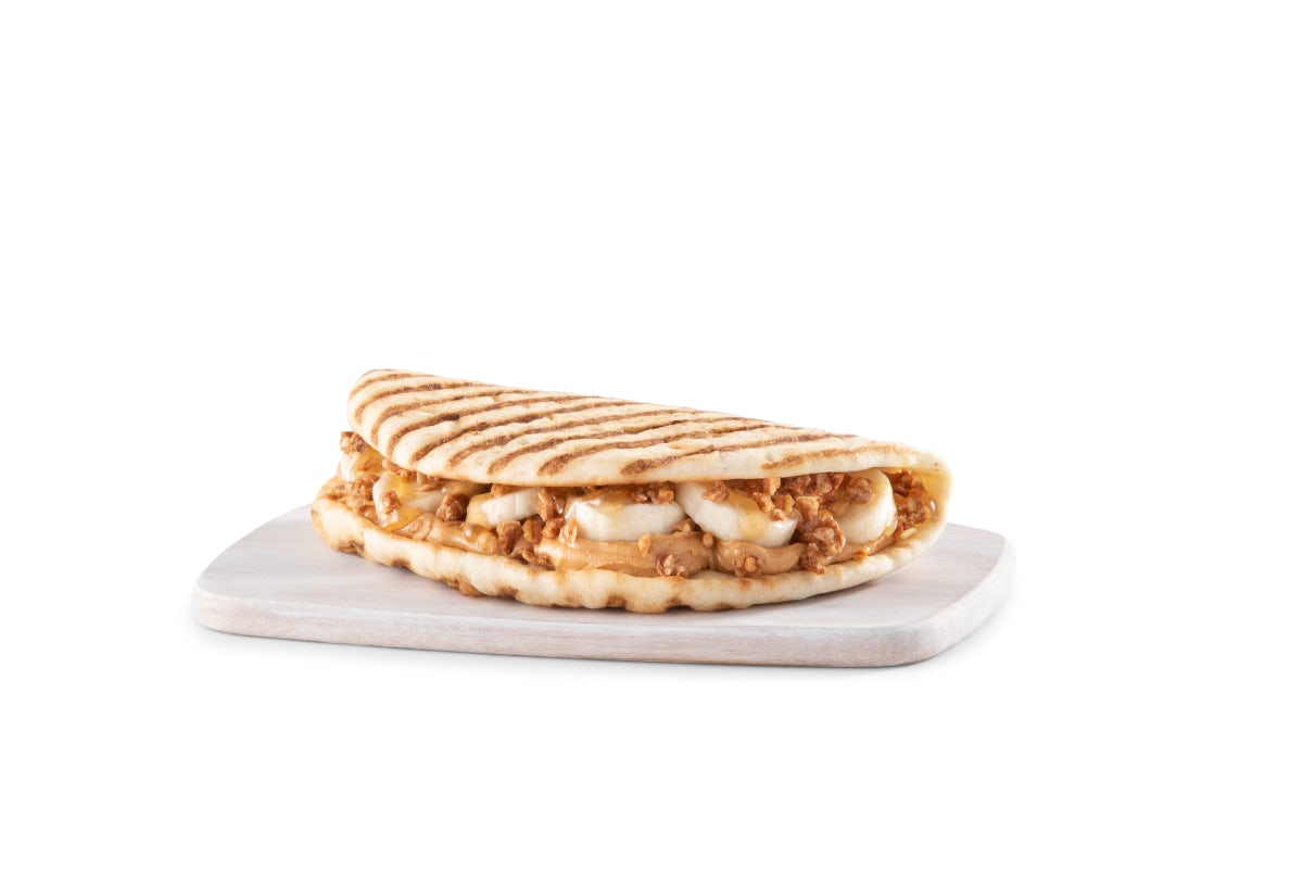 Order PEANUT BUTTER BANANA CRUNCH FLATBREAD food online from Tropical Smoothie Cafe store, Bay Shore on bringmethat.com