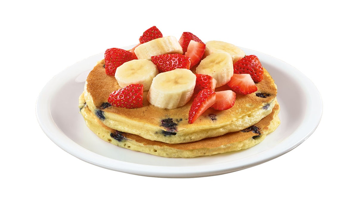 Order Stack of Double Berry Banana Strawberry Pancakes  food online from Denny's store, Thomasville on bringmethat.com