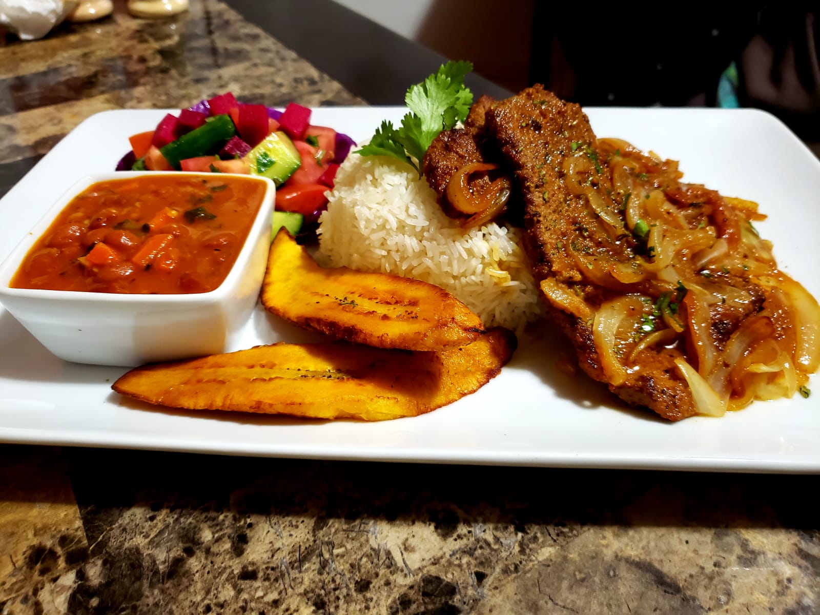 Order Steak Onions Sauteed in Telleria Marinade food online from Manjares Del Caribe store, Randolph on bringmethat.com