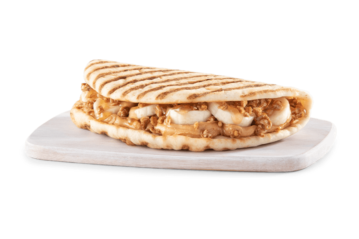 Order PEANUT BUTTER BANANA CRUNCH FLATBREAD food online from Tropical Smoothie store, Virginia Beach on bringmethat.com