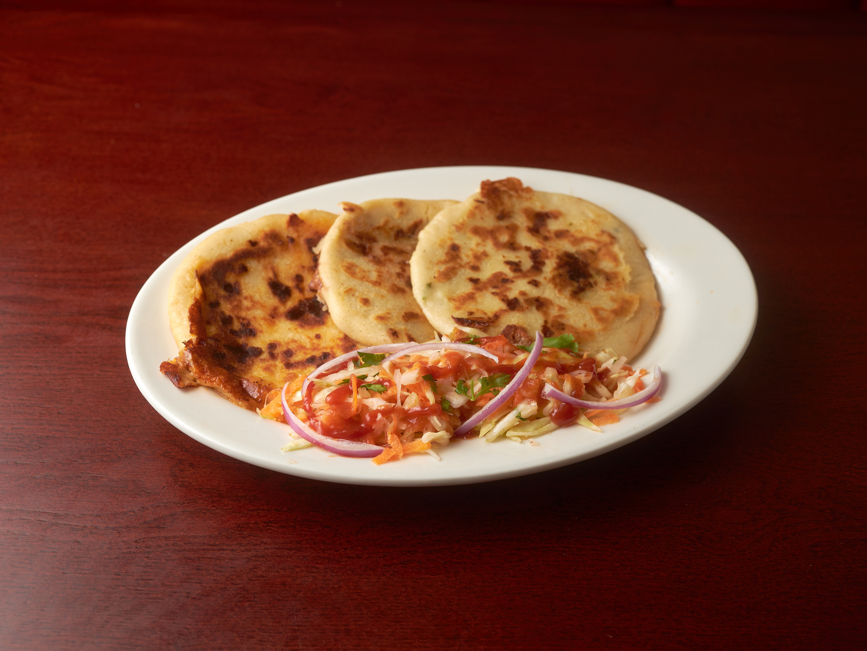 Order Pupusas Revueltas (chicharron y queso) food online from Don Miguel Restaurant store, Jamaica on bringmethat.com