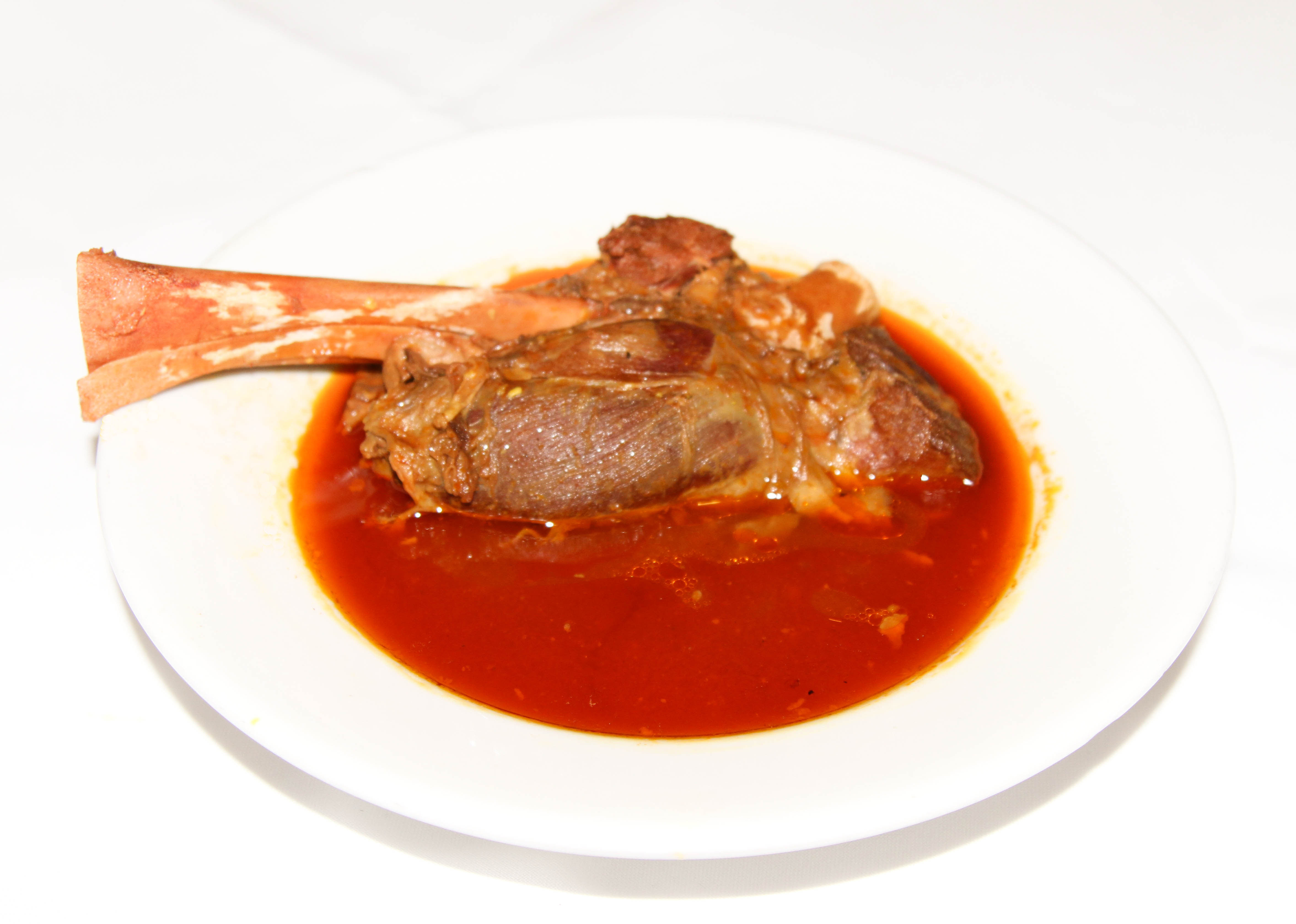 Order Lamb Shank food online from Shaherzad Restaurant store, Los Angeles on bringmethat.com