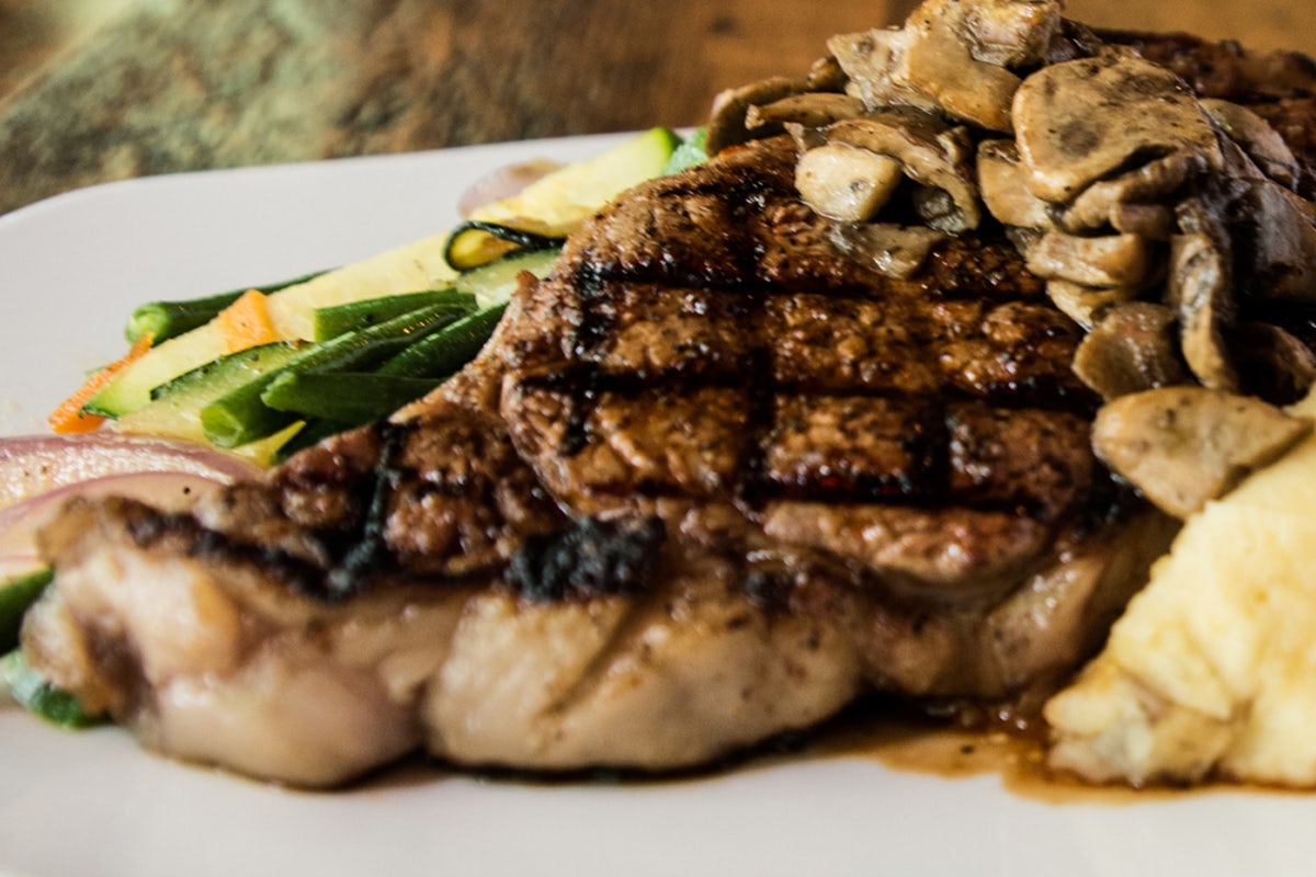 Order 28-Day Aged Ribeye* food online from Carolina Ale House store, Wake Forest on bringmethat.com