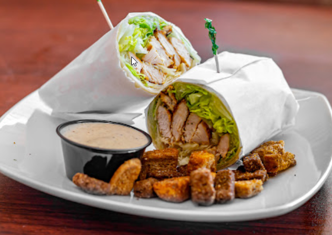 Order Grilled Chicken Caesar Wrap food online from Rigatoni's store, Hauppauge on bringmethat.com