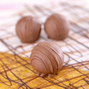 Order Peanut-Butter Bite-Size Truffle, Milk Chocolate food online from Wockenfuss Candies store, Columbia on bringmethat.com