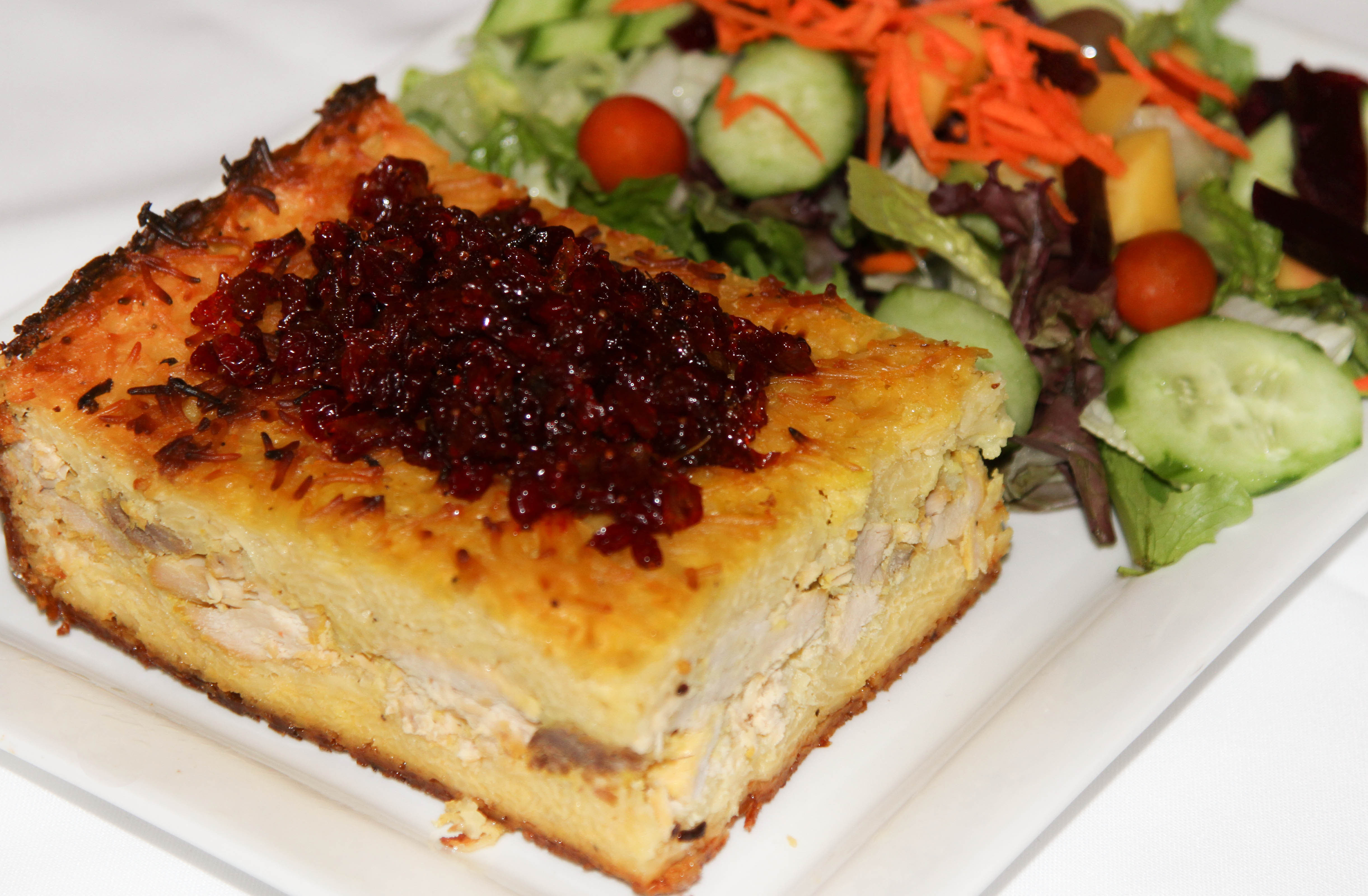 Order Tahchin food online from Shaherzad Restaurant store, Los Angeles on bringmethat.com