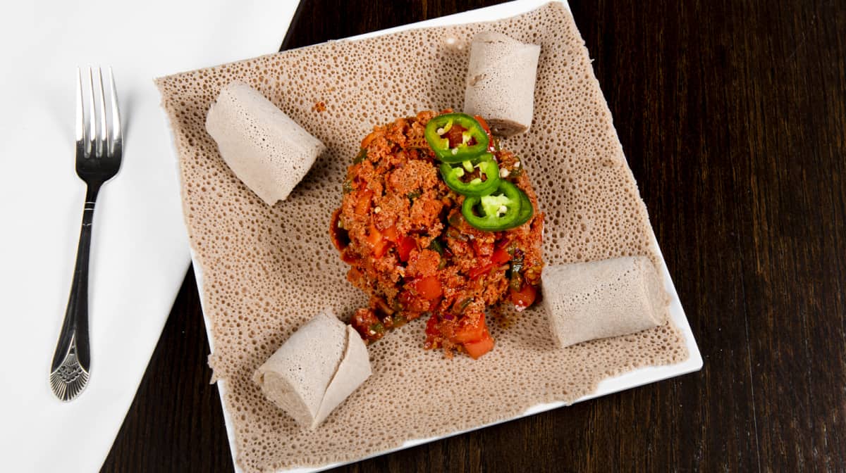 Order Timatim Fitfit food online from Makeda Ethiopian Restaurant store, Alexandria on bringmethat.com
