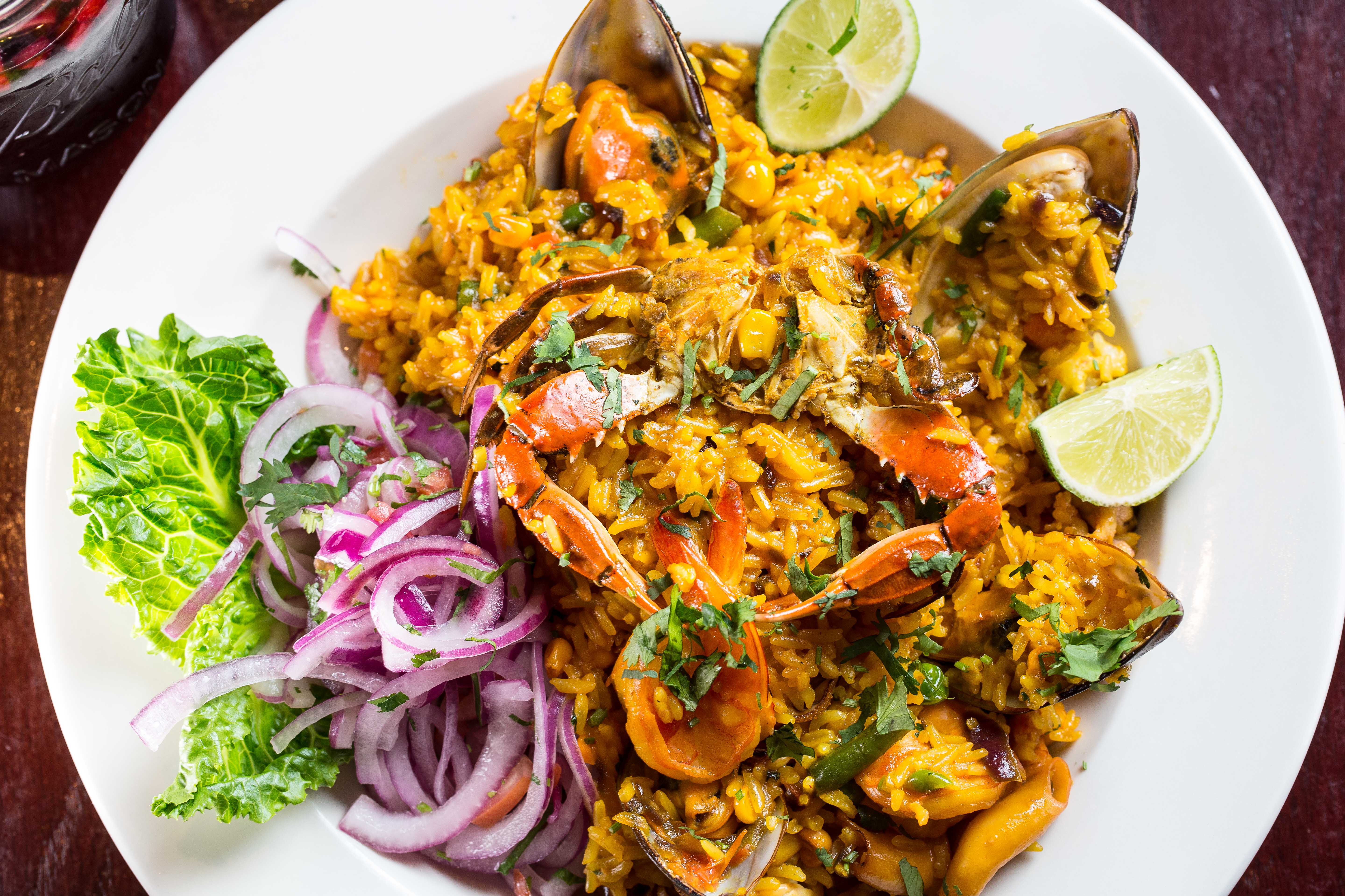Order Arroz con Mariscos food online from Riko Peruvian Cuisine store, Queens on bringmethat.com