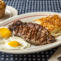 Order Rib-Eye Steak with 2 Ranch Eggs food online from Hof Hut store, Long Beach on bringmethat.com
