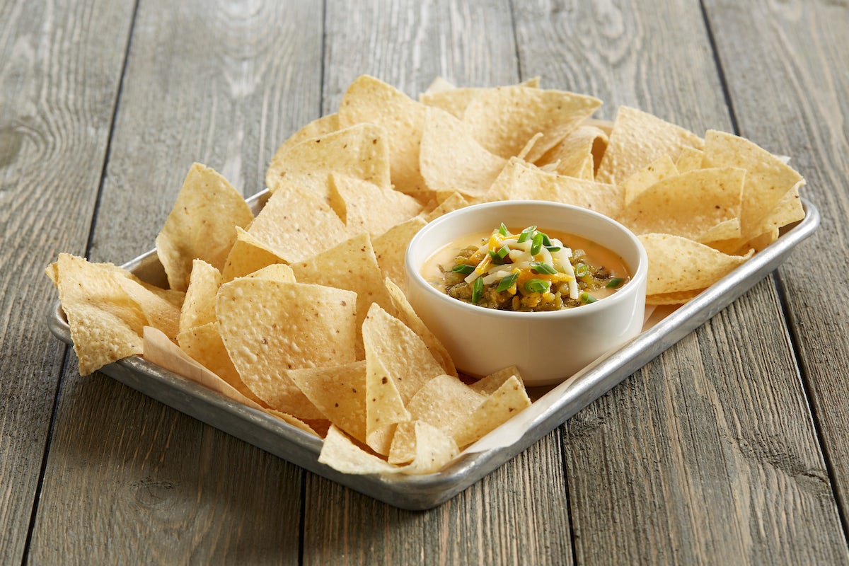 Order Sriracha Queso Dip With Seared Hatch Chiles food online from BJ's Restaurant & Brewhouse store, Waco on bringmethat.com