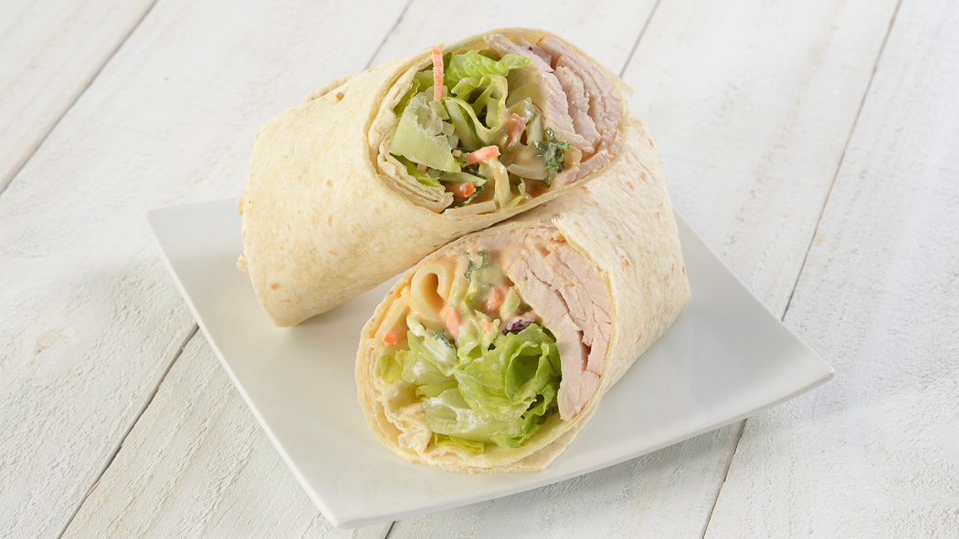Order Turkey, Swiss and Slaw Wrap food online from Nature's Table- Tower Place store, Tampa on bringmethat.com