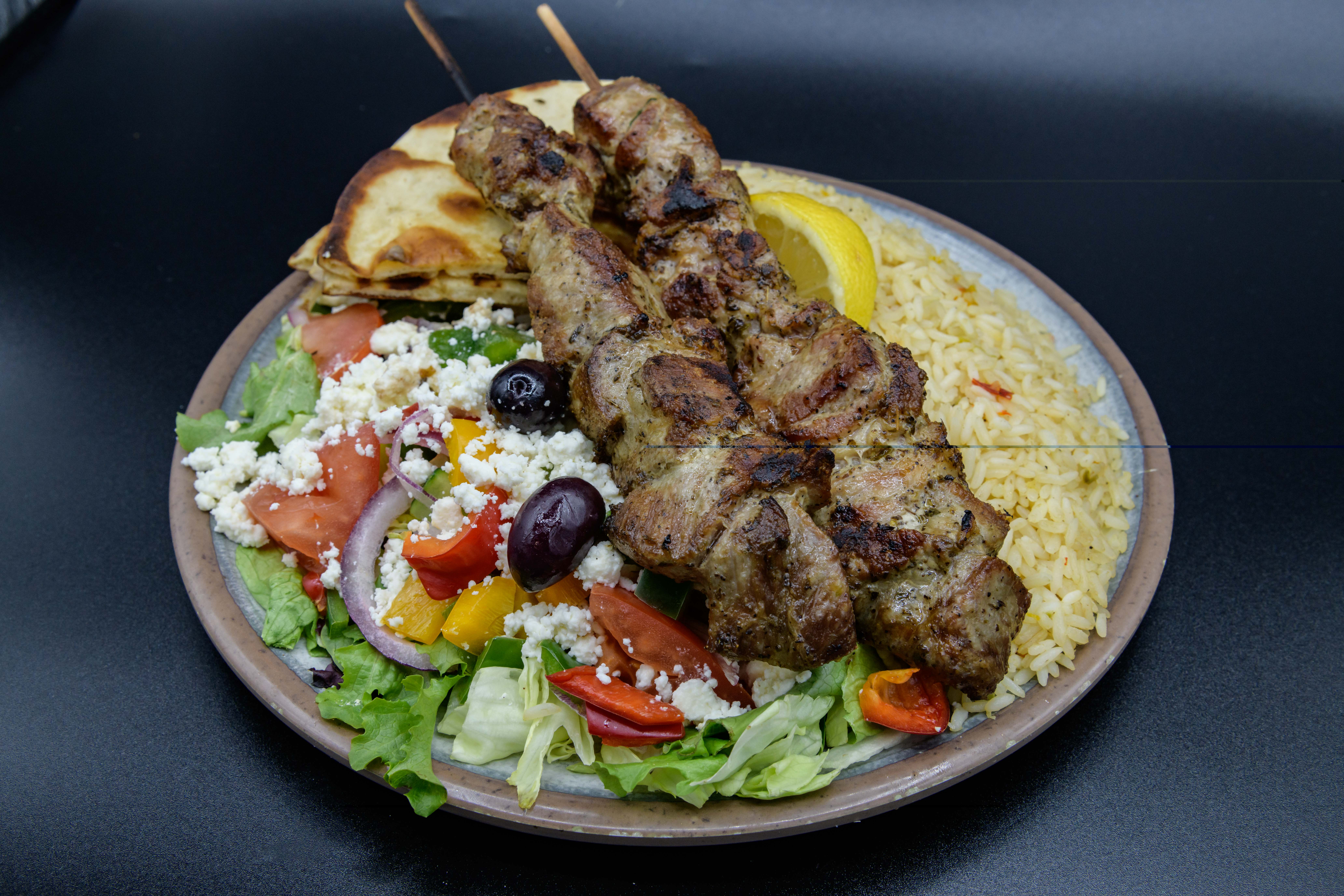 Order Pork Souvlaki Dinner food online from Gyro City store, Brighton on bringmethat.com