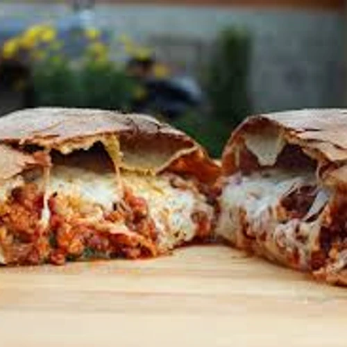Meat Lover Calzone from Roma Pizza