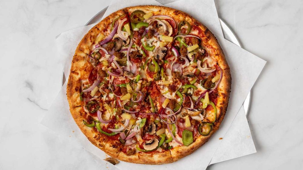 Order Supreme Pizza food online from World Cup Cafe store, Los Angeles on bringmethat.com