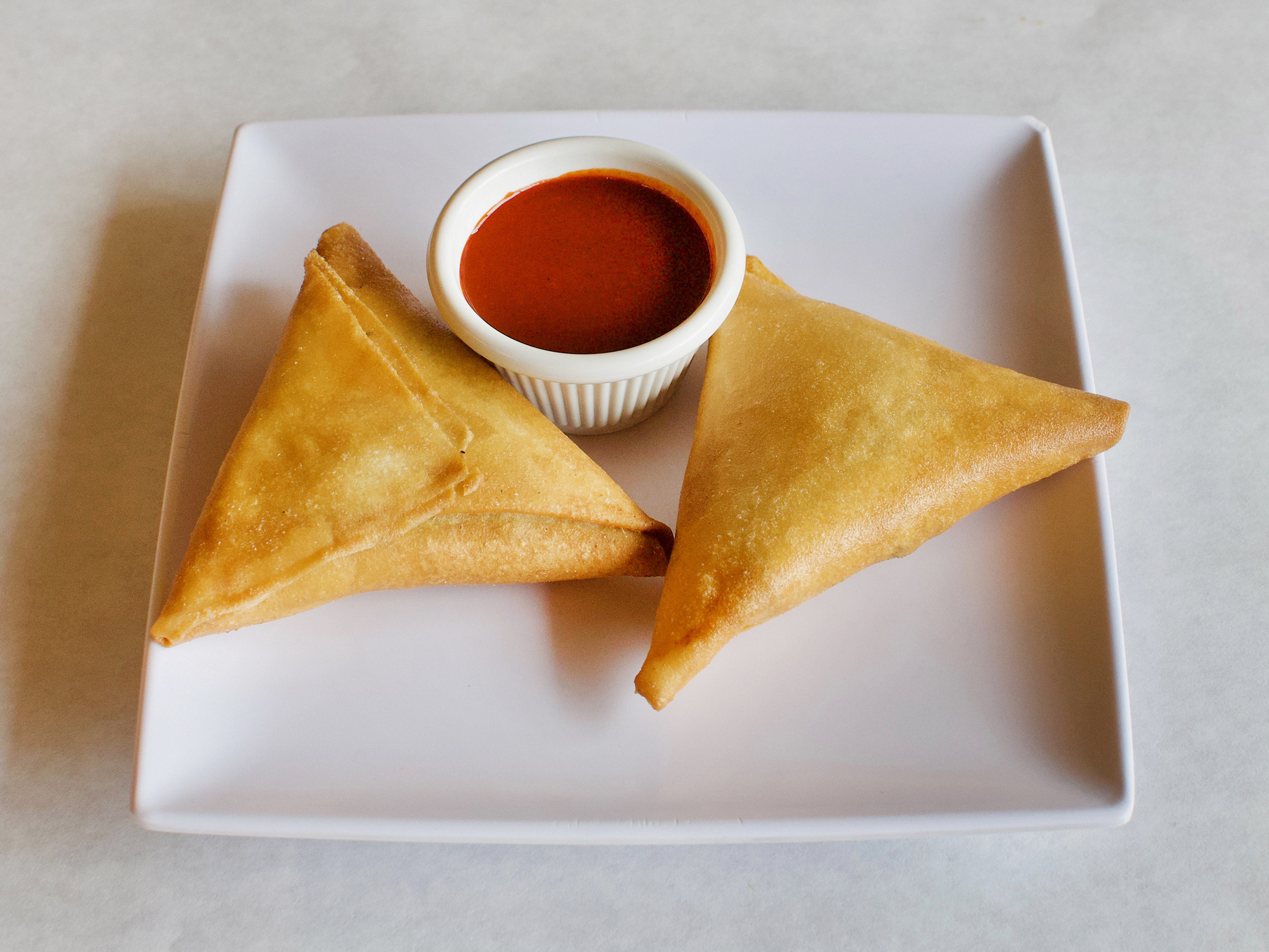 Order Sambusa food online from Makeda Ethiopian Restaurant store, Alexandria on bringmethat.com