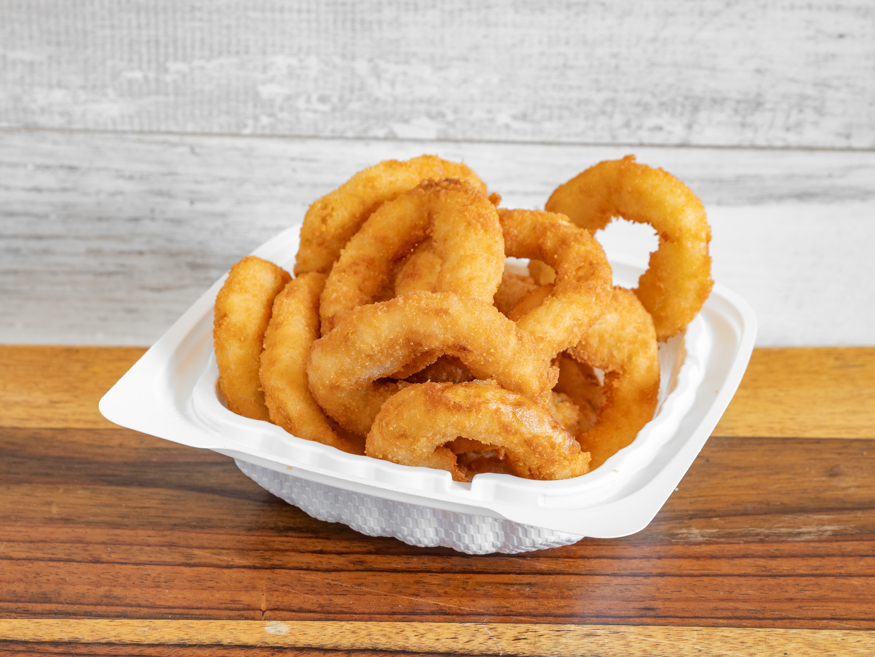 Order Onion Rings food online from Atlantic Fish N Chips store, New York on bringmethat.com
