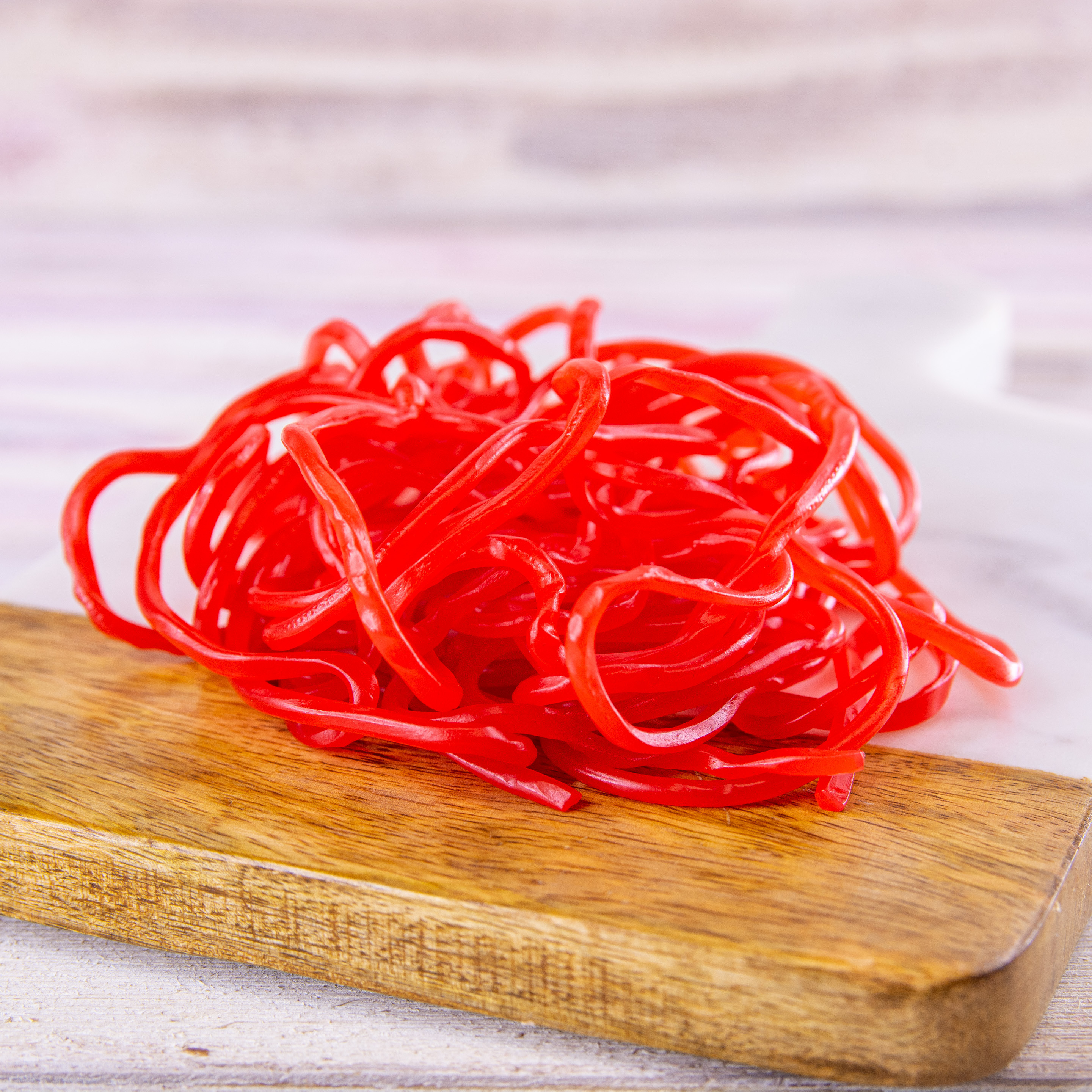 Order Strawberry Shoestring Licorice, 4 Bags food online from Wockenfuss Candies store, Columbia on bringmethat.com
