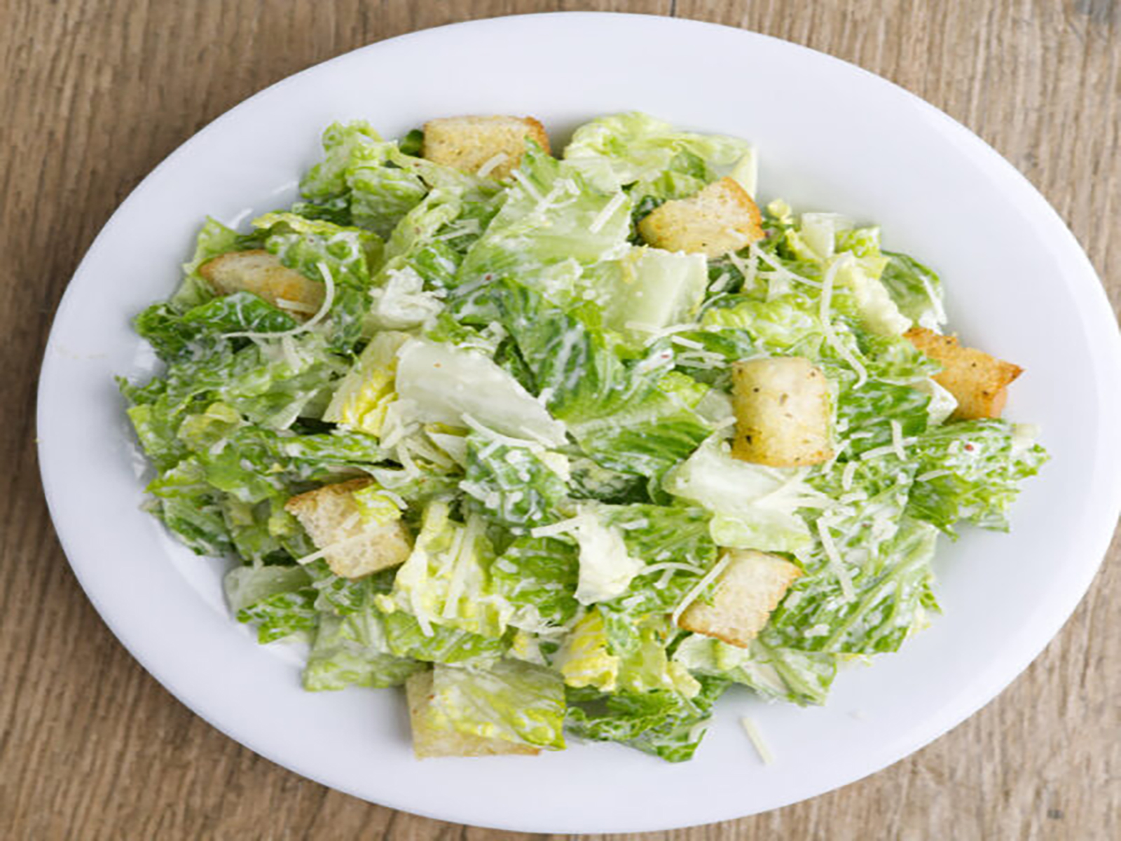 Order Caesar Salad food online from Buccaneer Pizza store, Santa Ana on bringmethat.com