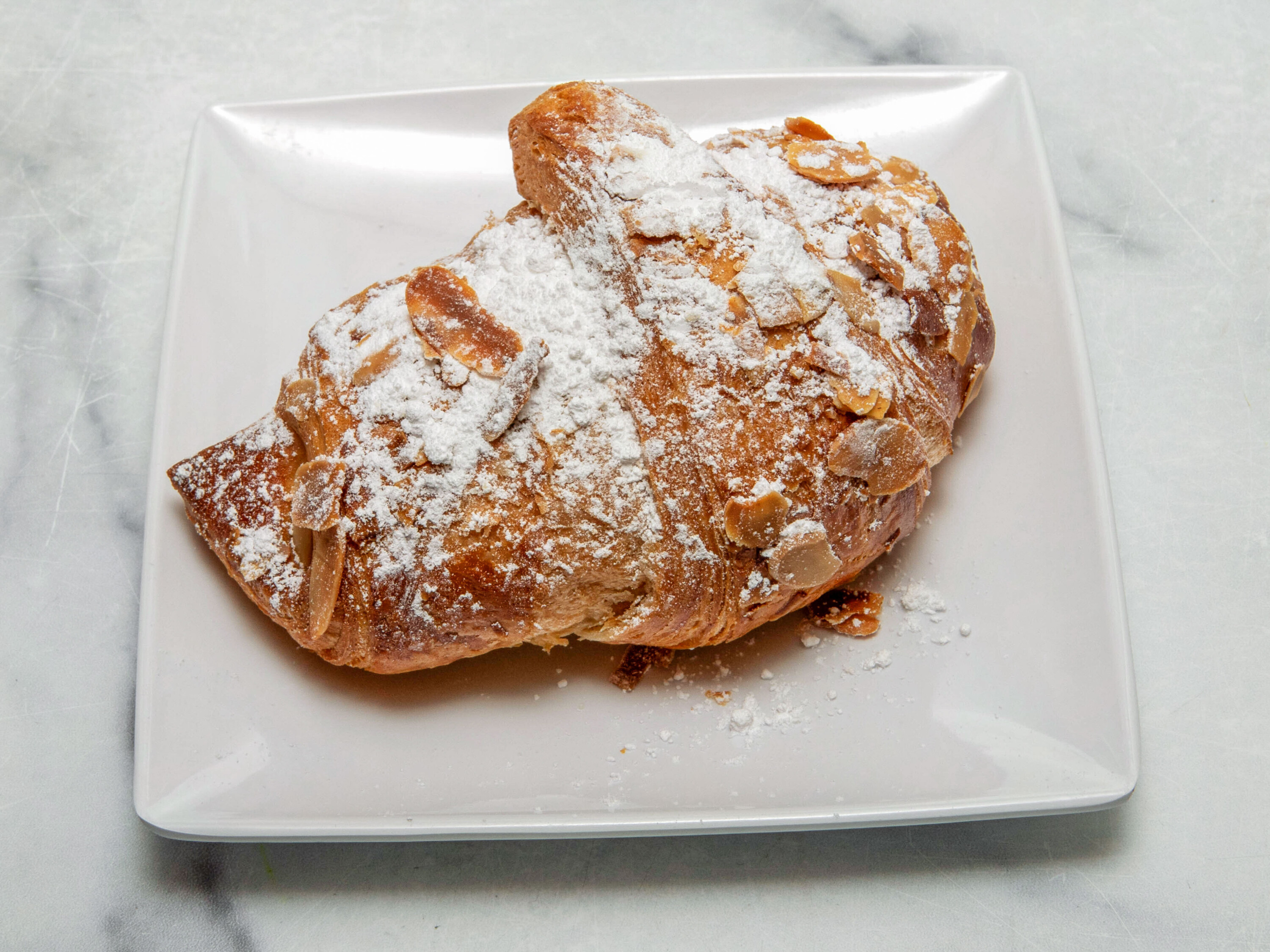 Order Almond Croissant food online from NYC Bagel and Coffee House store, Queens on bringmethat.com