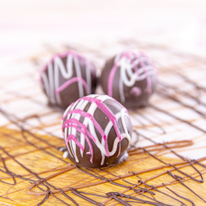 Order Strawberry Cheesecake Bite-Size Truffle, Dark Chocolate food online from Wockenfuss Candies store, Columbia on bringmethat.com