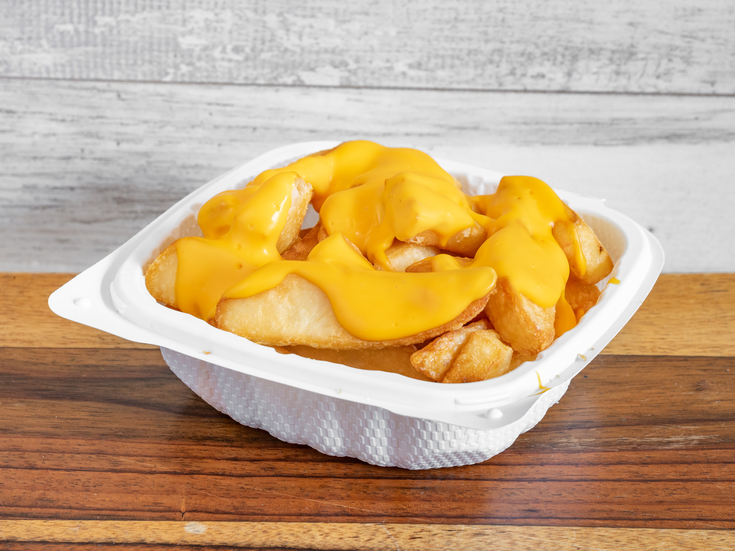 Order Cheese Fries food online from Atlantic Fish N Chips store, New York on bringmethat.com