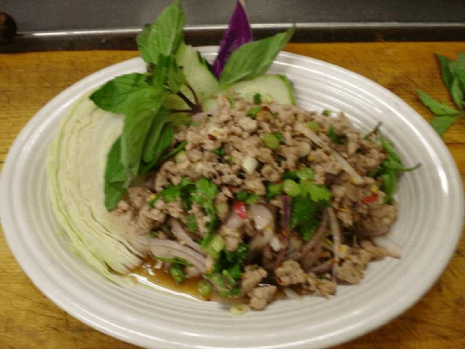 Order * Larb Gai food online from Racha Thai store, Seattle on bringmethat.com