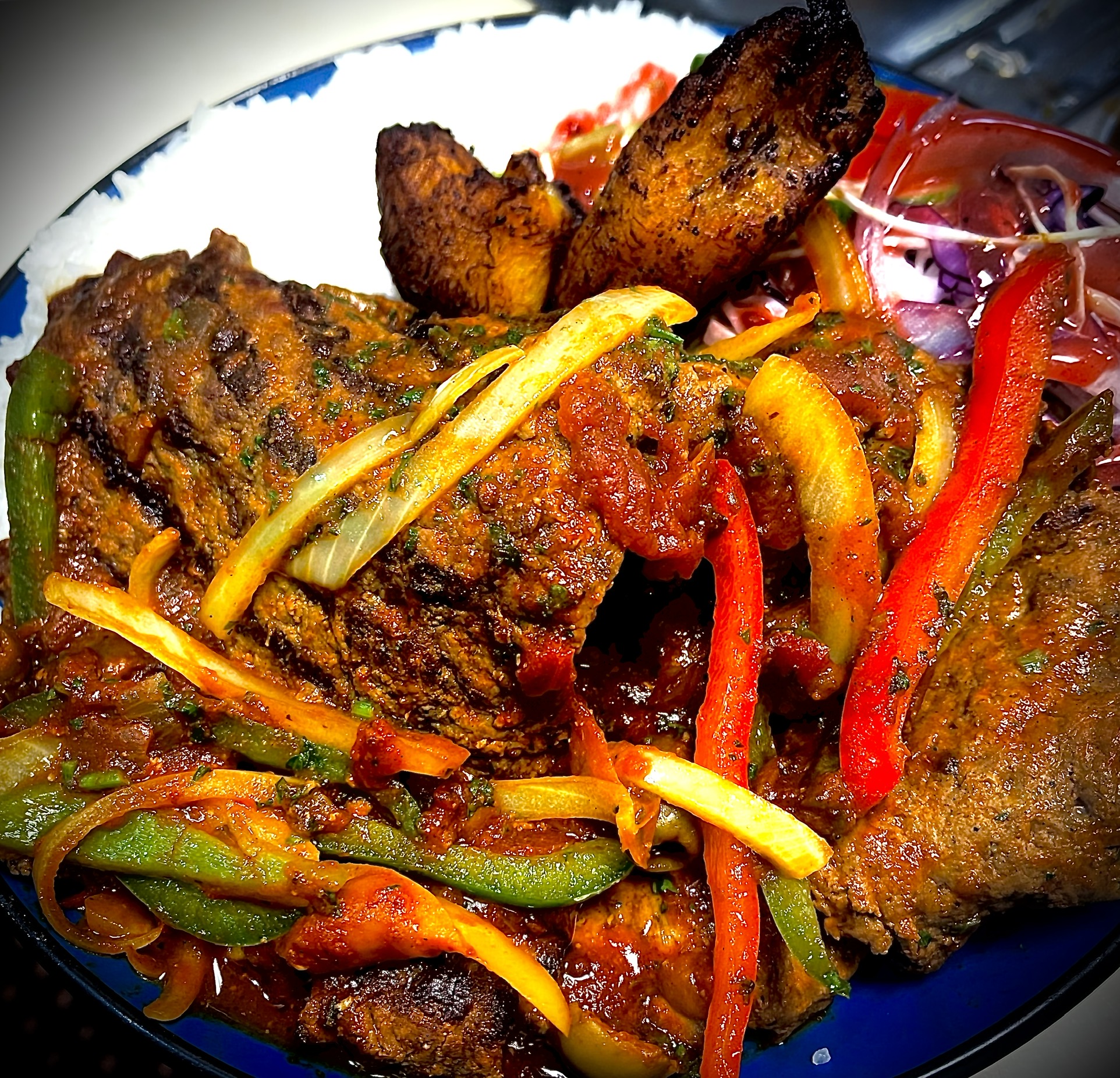 Order Steak Onions in Creole Sauce food online from Manjares Del Caribe store, Randolph on bringmethat.com